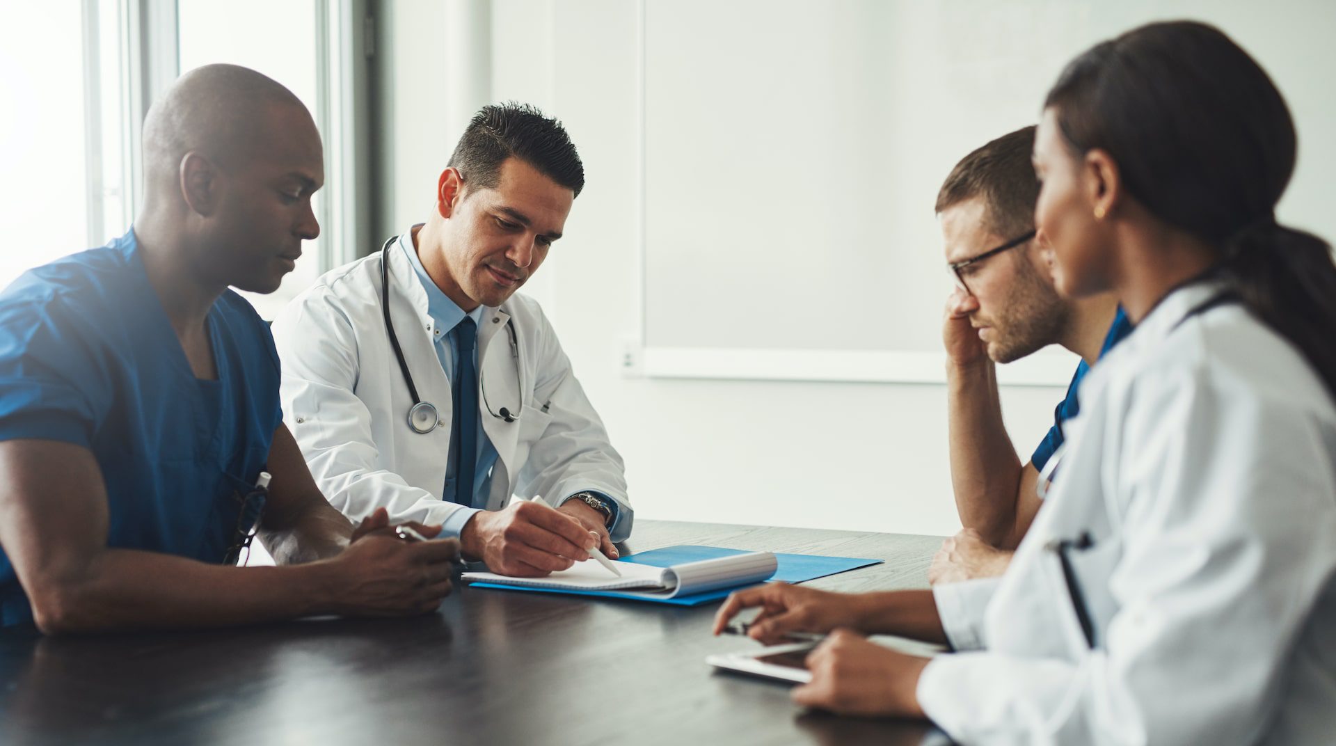 Medical professionals talking to client about Iron Infusion for Anemia